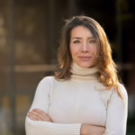 Mature blonde executive woman looking camera with long sleeve sweater outdoors 236157 830